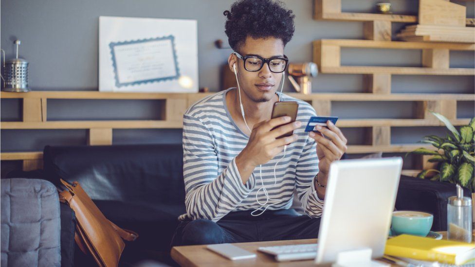 young man buying products online