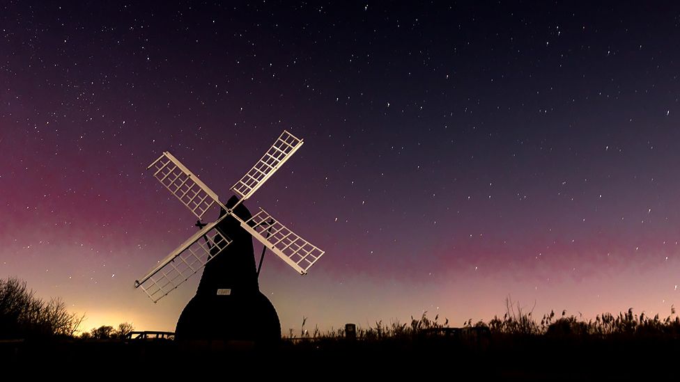 Northern lights over a windmill at Wicken in Cambridgeshire