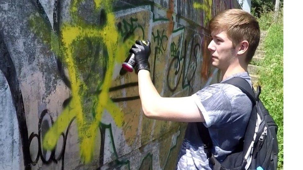 Hannam spraying graffiti