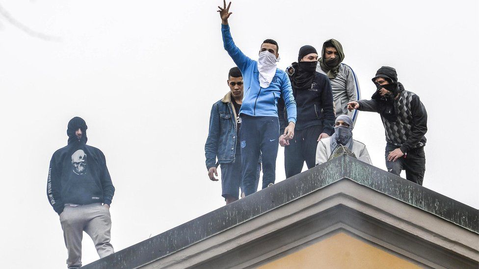 Detainees protest on the roof of the San Vittore prison in Milan, northern Italy, 9 March 2020