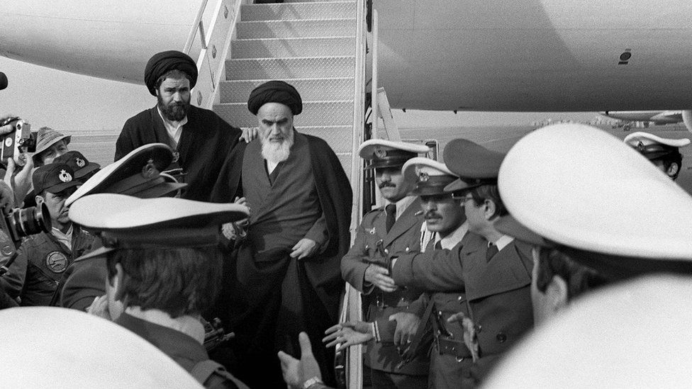 Khomeini arrives in Iran