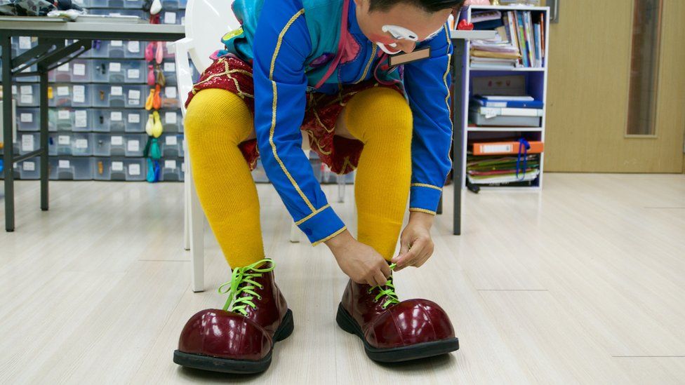 Ken Ken puts on his oversize clown shoes