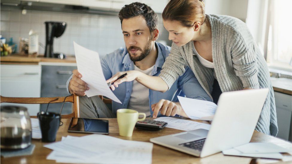 Couple looking at their bills