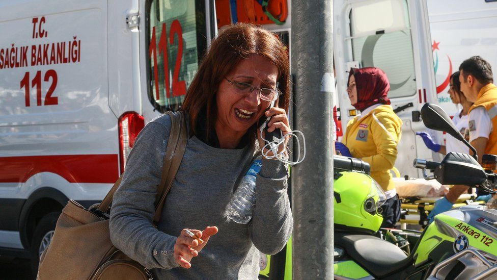 A survivor talking on a phone after the explosions in Ankara, Turkey - Saturday 10 October 2015