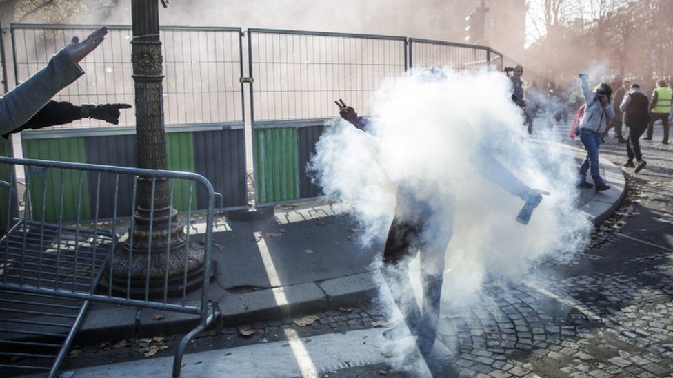 Tear gas is used to disperse protesters in Paris
