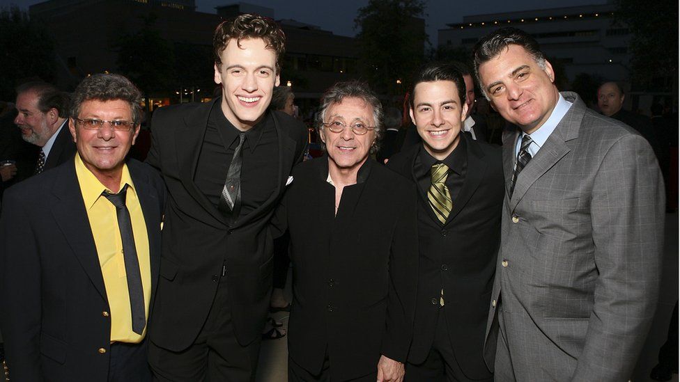 Siravo (far right) poses for pictures alongside Frankie Valli (centre) during the opening night party for Jersey Boys the 2006