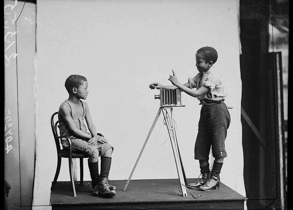 Two boys taking a photo