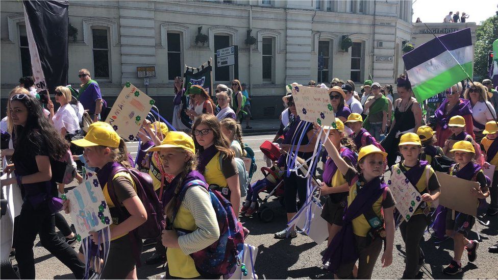 Brownies, carrying home made banners took part in the march