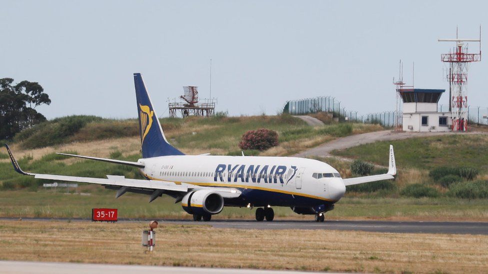 A Ryanair plane lands at Lisbon airport