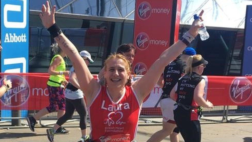 Laura finishing a marathon