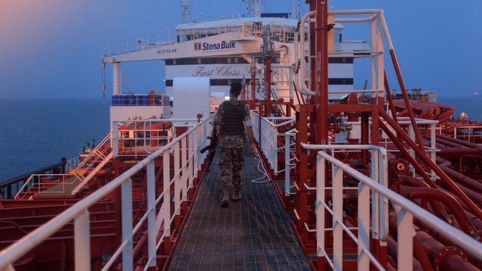 An Iranian Revolutionary Guard member walks onboard the Stena Impero
