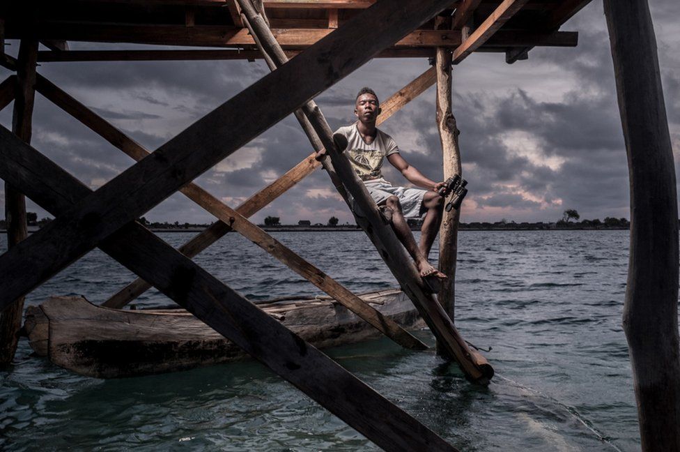 Petain Xavier Faralahi, 22, works as a guard in the sea-cucumber fields.