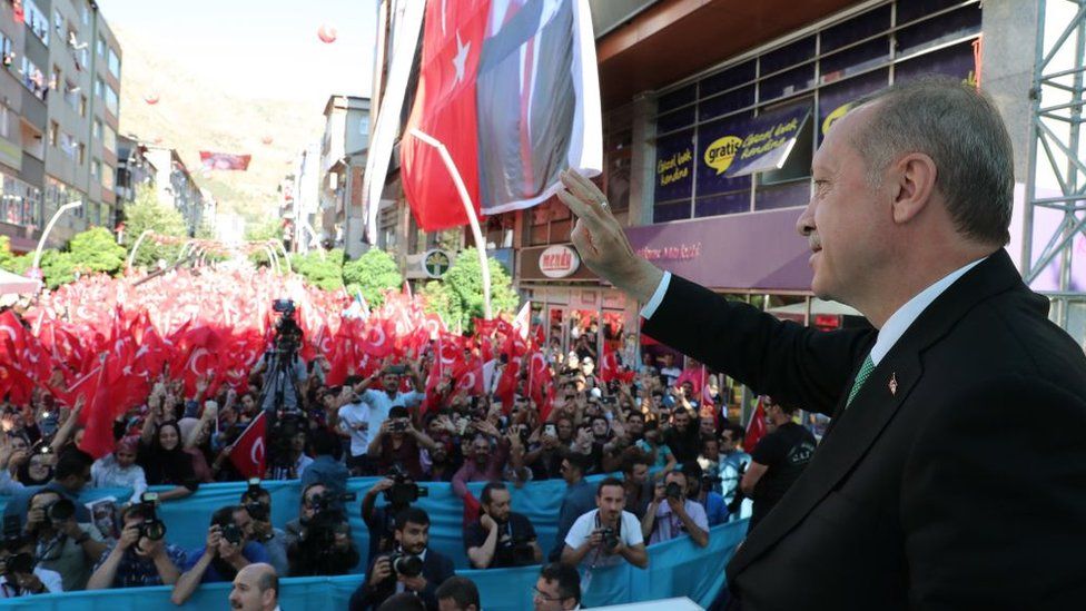 Mr Erdogan speaks to a crowd