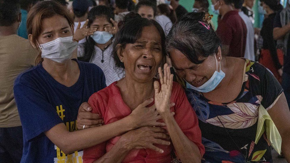 Family members and relatives attend the funeral ceremony of 13 year-old Sai Wai Yan