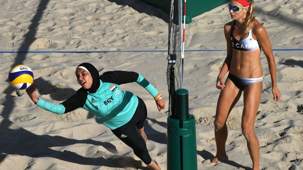 Egypt's Doaa Elghobashy dives for the ball during the women's beach volleyball