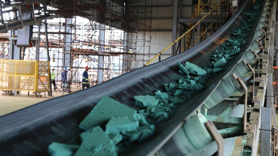 A conveyor belt carries chunks of Raw cobalt after a first transformation at a plant in Lubumbashi on February 16, 2018, before being exported, mainly to China, to be refined.