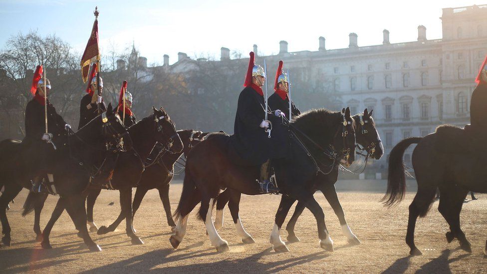 Guards riding to Buckingham Palace