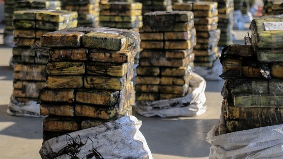 Packages of cocaine that were hidden in a shipment of six charcoal containers that were to be shipped to Israel are seen after being seized by an anti-narcotics unit in the Terport de Villeta port in Villeta near Asuncion, Paraguay, October 20, 2020.