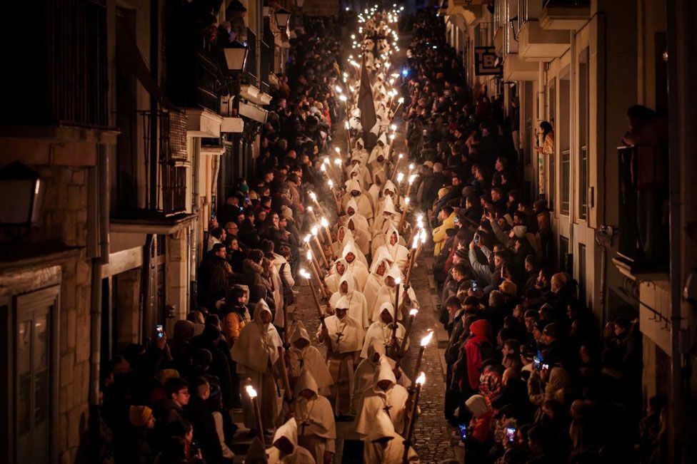 "Cristo de la Buena Muerte" brotherhood's Penitents take part in a procession during Holy Week in the north-western Spanish city of Zamora on March 25, 2024.