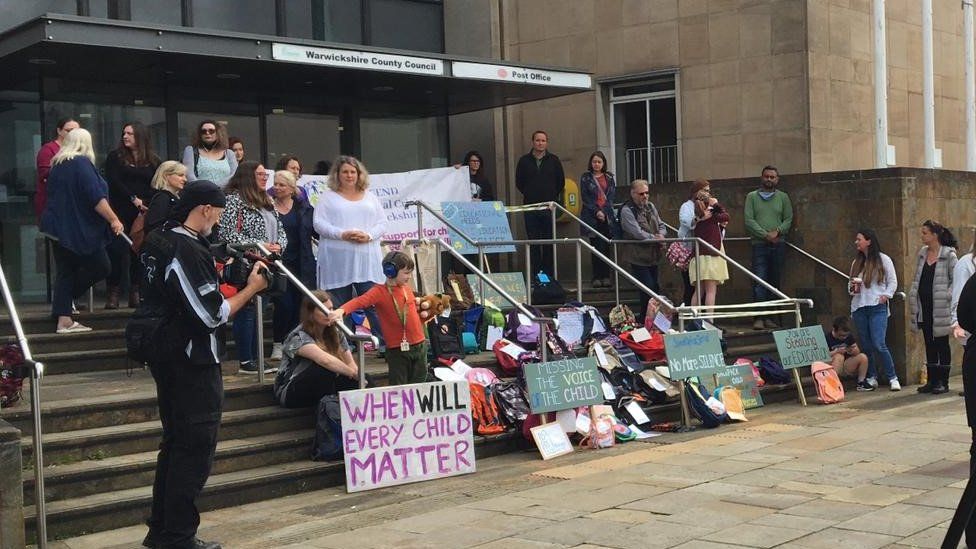 Parents gathered outside Shire Hall in Warwick