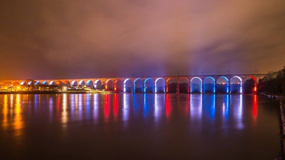 Bridge in Berwick-upon-Tweed lit up the colour of the French flag