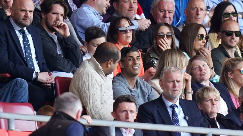 Rishi Sunak surrounded by people in the stands of St Mary's