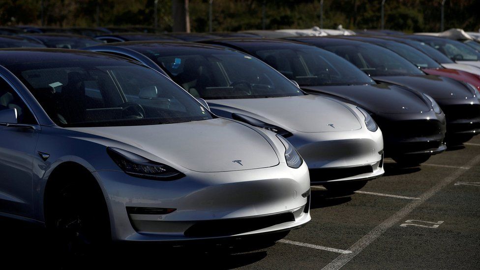 A row of new Tesla Model 3 cars