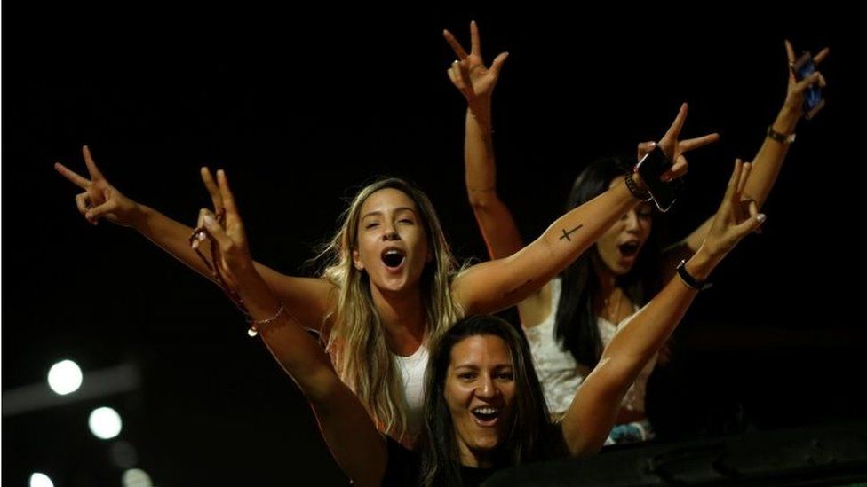 Supporters of Jair Bolsonaro cheer after he was elected president of Brazil