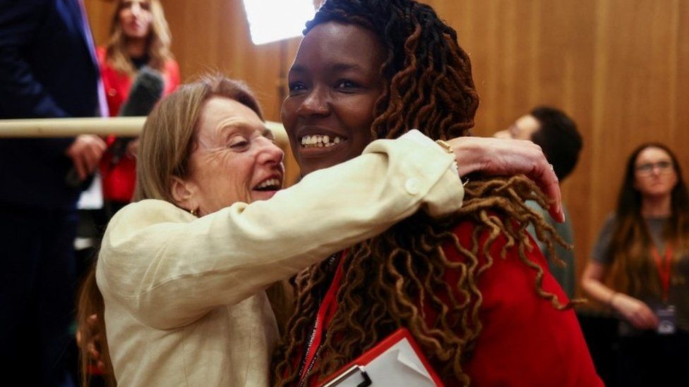 Labour party supporters react to the announcements of wins during local elections, at Wandsworth Town Hall, London