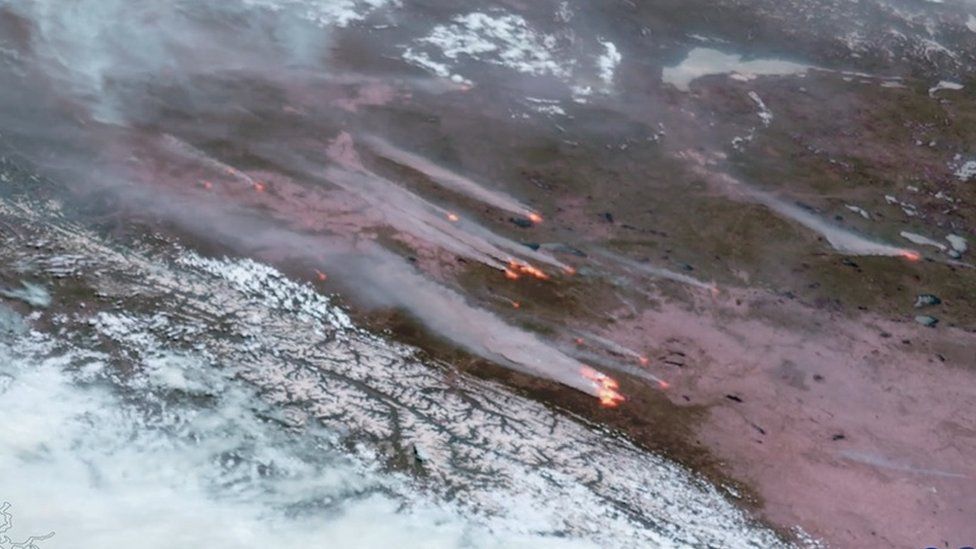 Satellite images showing Alberta fires burning from above
