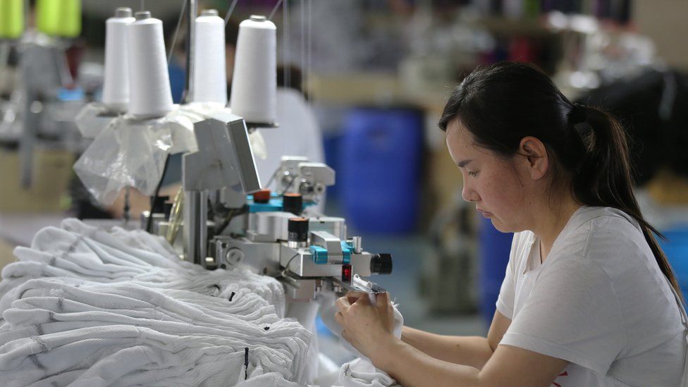 Chinese factory worker uses machine