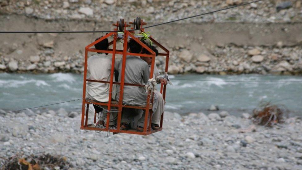 A makeshift cable car powered by a car engine