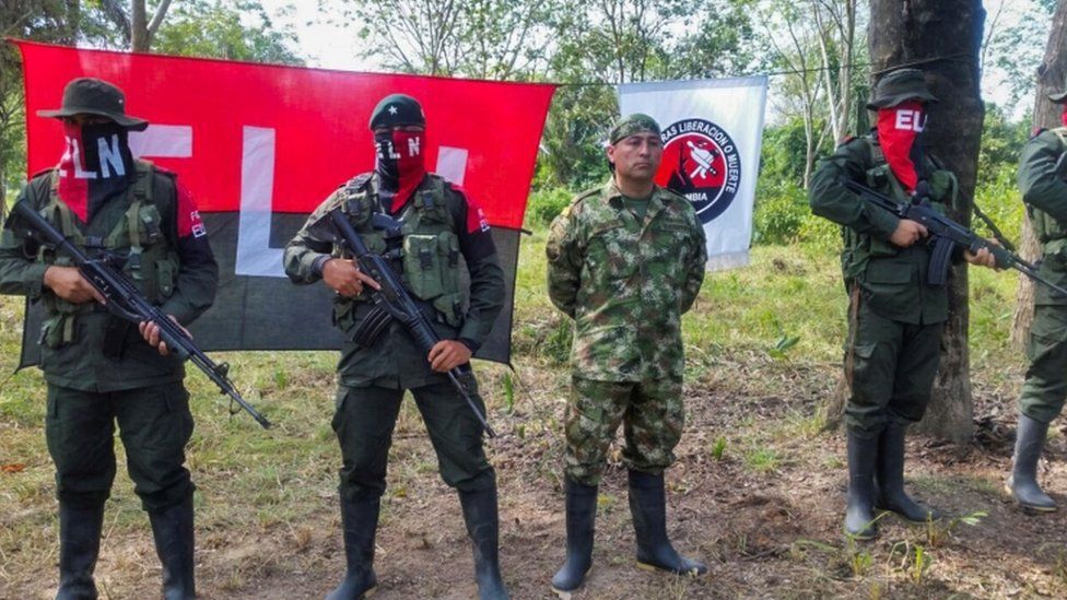 Soldier Freddy Moreno, third from the left, alongside ELN rebels