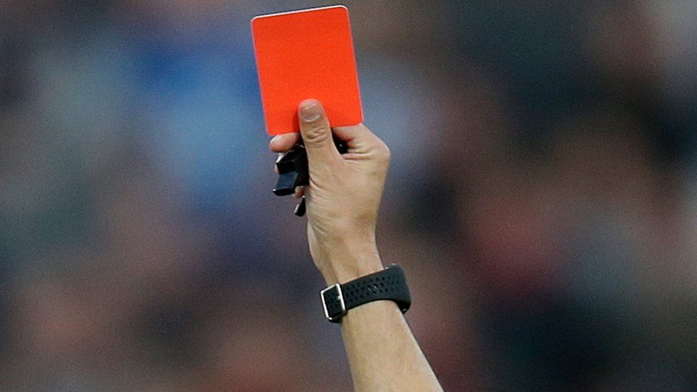 A red card is shown