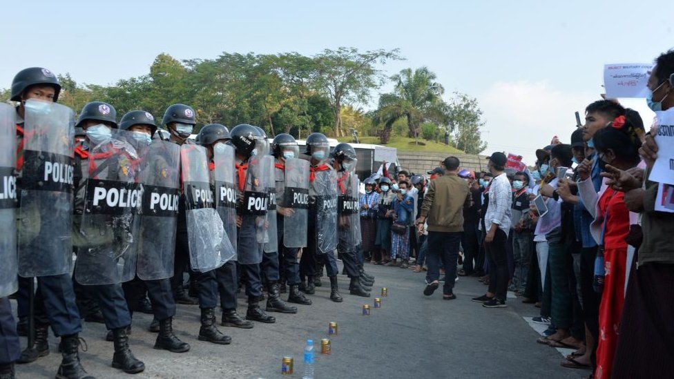 Protesters face off riot police during a demonstration against the military coup in Naypyidaw on February 8, 2021. (