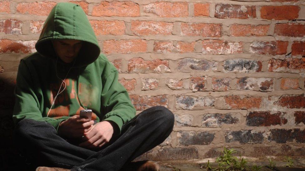 Generic picture of a young person in an alley