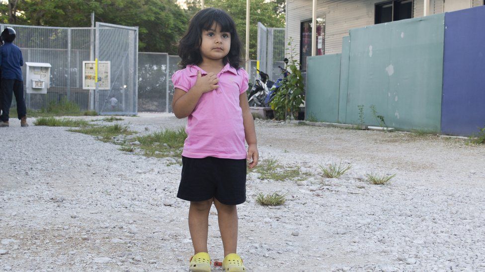 Two-year-old Roze stands on the gravel on the island of Nauru