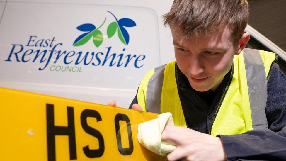 Council Trainee cleans number plate