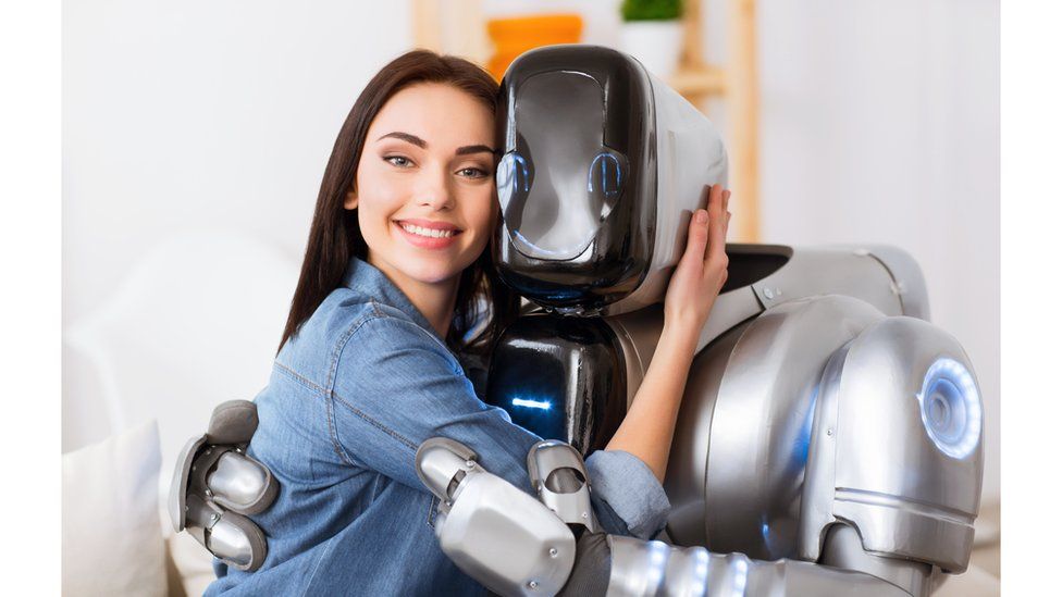Woman and robot hugging