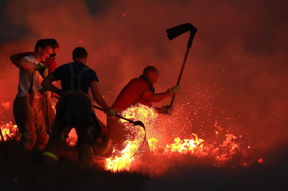 Fire fighters tackle a wild fire on Winter Hill near Bolton. 28 June 2018.