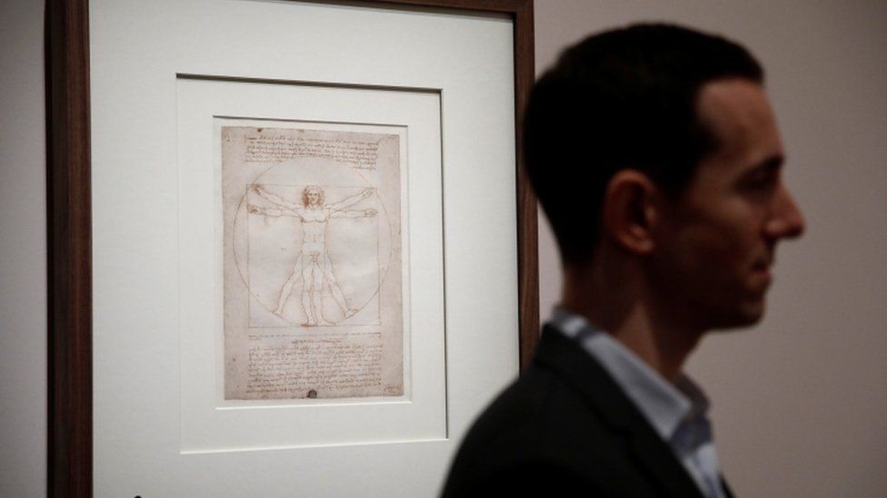The Vitruvian Man - a drawing by Leonardo da Vinci is pictured during a press visit of the exhibition to commemorate the 500-year anniversary of his death at the Louvre Museum in Paris