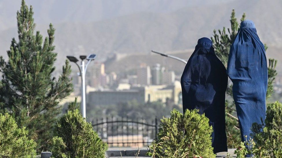 Two women wearing burqas