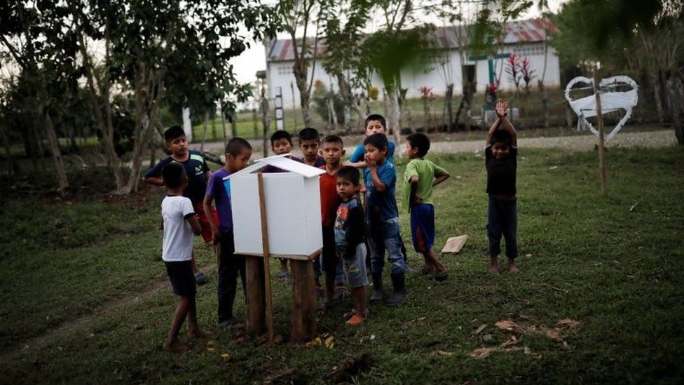 Children gather near a makeshift altar to Jakelin Caal in the village of San Antonio Secortez. Photo: 22 December 2018