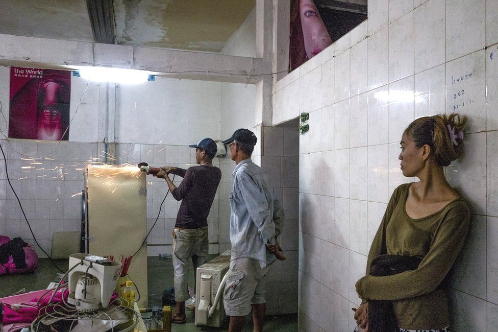 Residents inside an apartment in the White Building