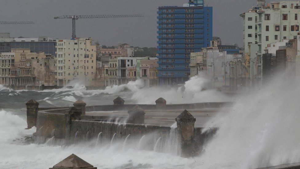 Waves crash over El Malecon boulevard in central Havana