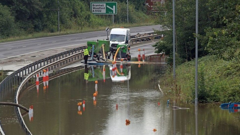 Flooding being pumped on A555 in Stockport