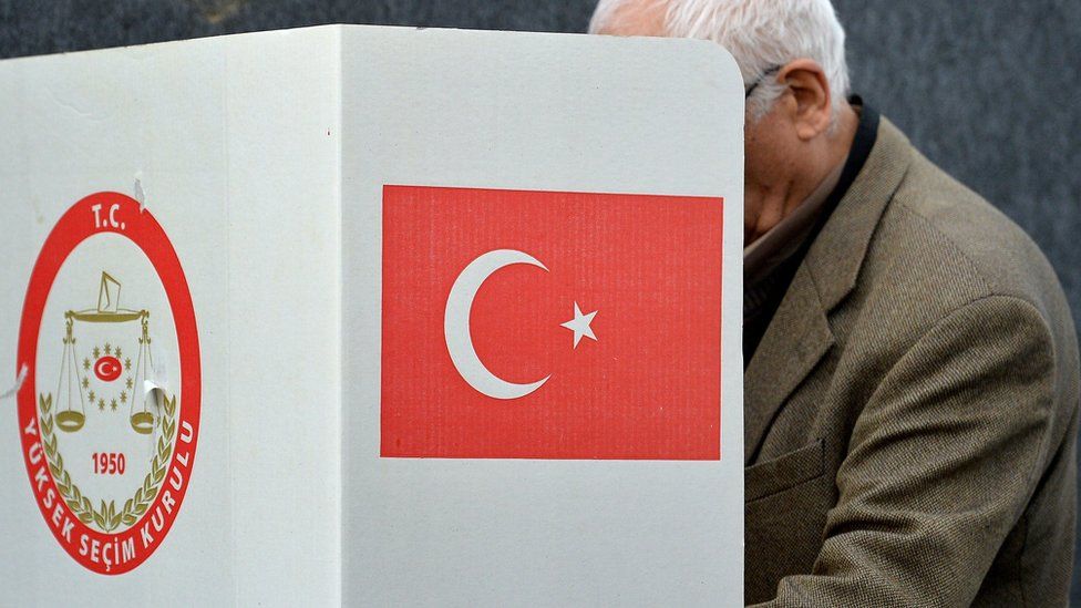 A man casts his vote for the Turkish constitution referendum, in the Turkish consulate general in Cologne, Germany, 27 March 2017