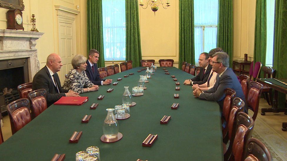Theresa May and Arlene Foster joined by senior colleagues in Cabinet room