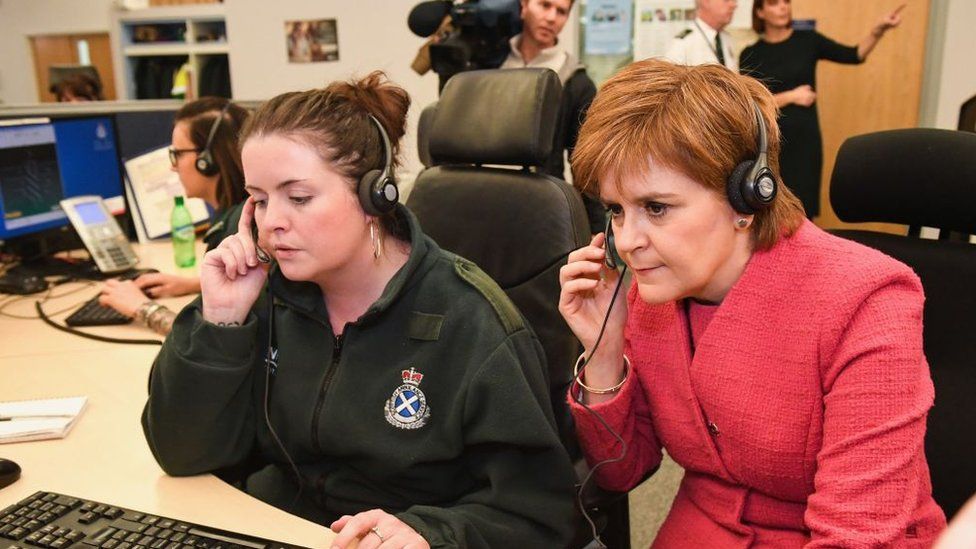 NIcola Sturgeon with an emergency call handler in 2018