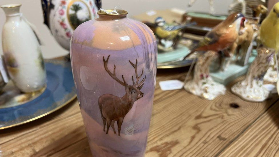 Pink vase with a stage in a snow scene